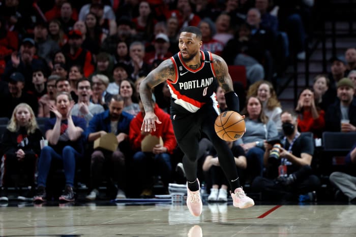 Portland Trail Blazers guard Damian Lillard dribbles the ball.